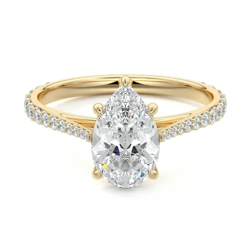 Pear cut Moissanite lab grown diamond engagement ring pave set shank with cathedral setting, on a gold band, against a white background.Moissanite engagement ring cape town south africa grand diamonds ralph jacobs jeulia 