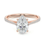 Pear cut Moissanite lab grown diamond engagement ring pave set shank with cathedral setting, on a gold band, against a white background.Moissanite engagement ring cape town south africa grand diamonds ralph jacobs jeulia 