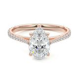 Pear cut Moissanite lab grown diamond engagement ring pave set shank with cathedral setting, on a gold band, against a white background.Moissanite engagement ring cape town south africa grand diamonds ralph jacobs jeulia 