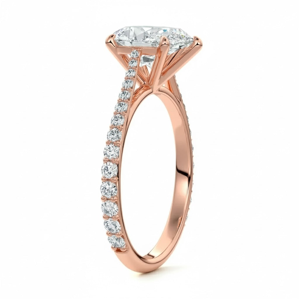 Pear cut Moissanite lab grown diamond engagement ring pave set shank with cathedral setting, on a gold band, against a white background.Moissanite engagement ring cape town south africa grand diamonds ralph jacobs jeulia 