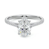 Pear cut Moissanite lab grown diamond engagement ring pave set shank with cathedral setting, on a gold band, against a white background.Moissanite engagement ring cape town south africa grand diamonds ralph jacobs jeulia 