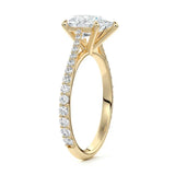 Pear cut Moissanite lab grown diamond engagement ring pave set shank with cathedral setting, on a gold band, against a white background.Moissanite engagement ring cape town south africa grand diamonds ralph jacobs jeulia 