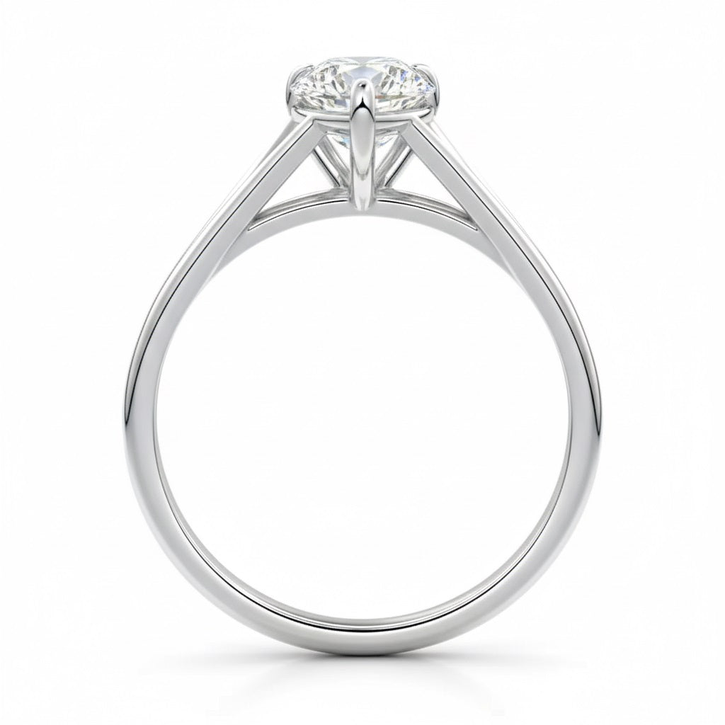 Pear cut Moissanite lab grown diamond engagement ring v-split band with a three claw cathedral setting, on a gold band, against a white background.Moissanite engagement ring cape town south africa grand diamonds ralph jacobs jeulia