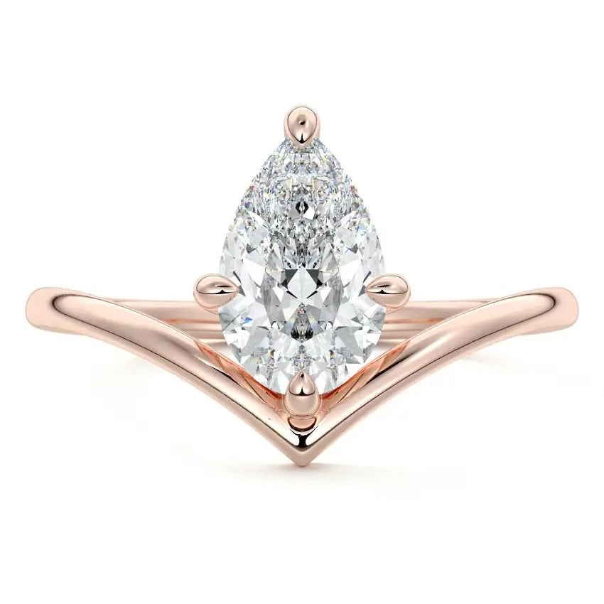Pear cut Moissanite lab grown diamond engagement ring v-split band with a three claw cathedral setting, on a gold band, against a white background.Moissanite engagement ring cape town south africa grand diamonds ralph jacobs jeulia  