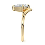 Pear cut Moissanite lab grown diamond engagement ring v-split band with a three claw cathedral setting, on a gold band, against a white background.Moissanite engagement ring cape town south africa grand diamonds ralph jacobs jeulia  