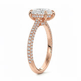 Pear cut Moissanite lab grown diamond engagement ring with three row micro pave set gold shank, hidden halo and moissanite encrusted claws against a white background.Moissanite engagement ring cape town south africa grand diamonds ralph jacobs jeulia 