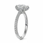 Pear cut Moissanite lab grown diamond engagement ring with three row micro pave set gold shank, hidden halo and moissanite encrusted claws against a white background.Moissanite engagement ring cape town south africa grand diamonds ralph jacobs jeulia 