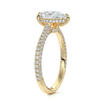 Pear cut Moissanite lab grown diamond engagement ring with three row micro pave set gold shank, hidden halo and moissanite encrusted claws against a white background.Moissanite engagement ring cape town south africa grand diamonds ralph jacobs jeulia 