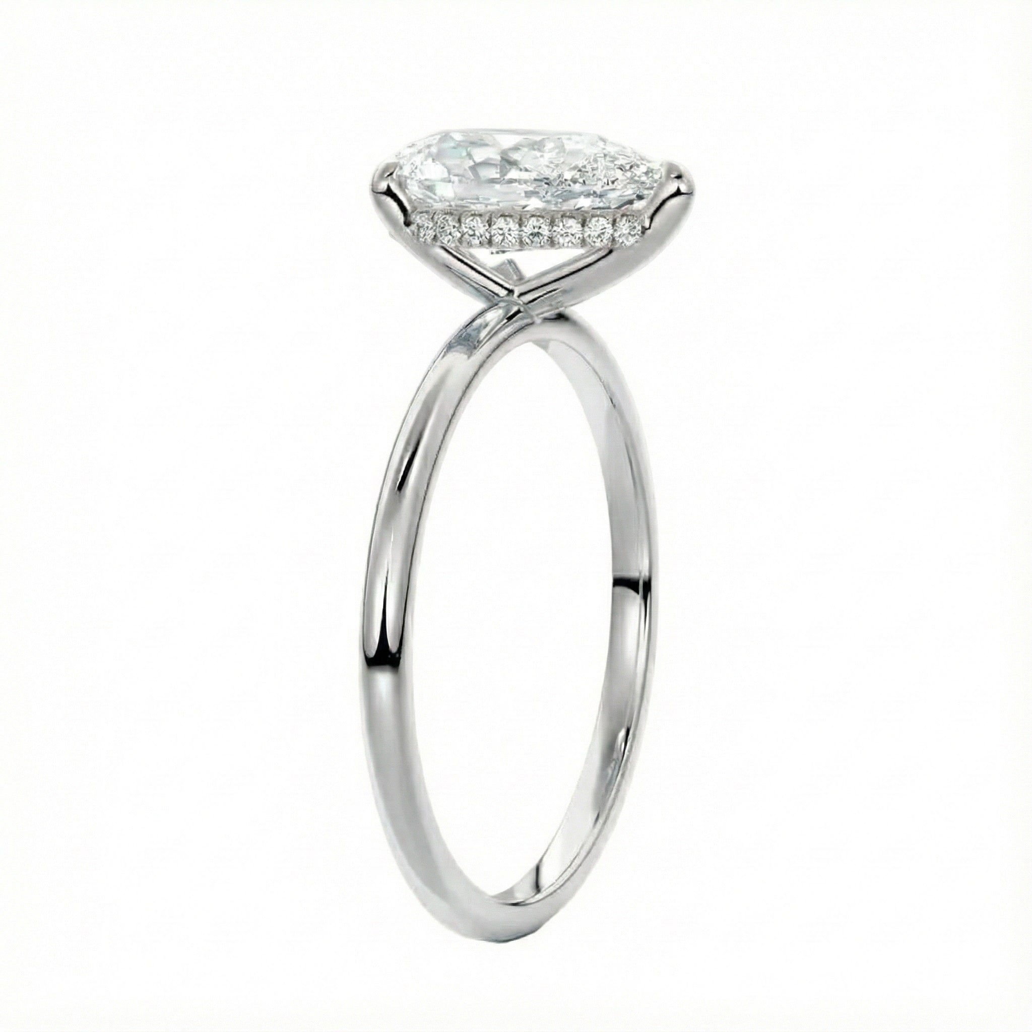 Engagement ring with pear cut moissanite or lab grown diamond solitaire three cat claw hidden halo in yellow rose or white gold hidden double halo and pave set shank Cape Town South Africa grand diamonds ralph jacobs jeuli