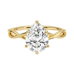 Pear cut Moissanite lab grown diamond engagement ring twisted shank with a six claw setting, on a gold band, against a white background.Moissanite engagement ring cape town south africa grand diamonds ralph jacobs jeulia  