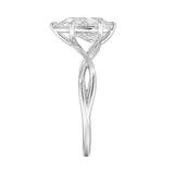 Pear cut Moissanite lab grown diamond engagement ring twisted shank with a six claw setting, on a gold band, against a white background.Moissanite engagement ring cape town south africa grand diamonds ralph jacobs jeulia  