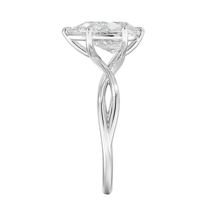 Pear cut Moissanite lab grown diamond engagement ring twisted shank with a six claw setting, on a gold band, against a white background.Moissanite engagement ring cape town south africa grand diamonds ralph jacobs jeulia  