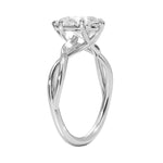 Pear cut Moissanite lab grown diamond engagement ring twisted shank with a six claw setting, on a gold band, against a white background.Moissanite engagement ring cape town south africa grand diamonds ralph jacobs jeulia  