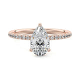 Pear cut Moissanite lab grown diamond engagement ring half eternity set shank with classic three prong setting, on a gold band, against a white background.Moissanite engagement ring cape town south africa grand diamonds ralph jacobs jeulia 