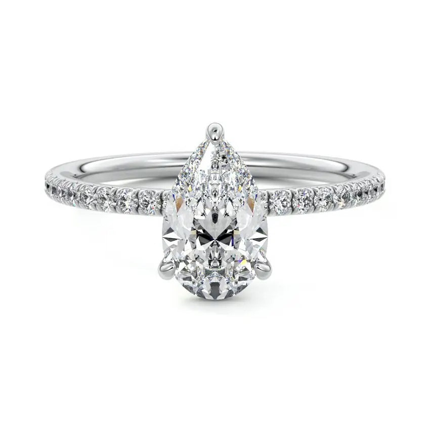 Pear cut Moissanite lab grown diamond engagement ring half eternity set shank with classic three prong setting, on a gold band, against a white background.Moissanite engagement ring cape town south africa grand diamonds ralph jacobs jeulia 