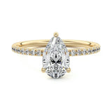 Pear cut Moissanite lab grown diamond engagement ring half eternity set shank with classic three prong setting, on a gold band, against a white background.Moissanite engagement ring cape town south africa grand diamonds ralph jacobs jeulia 