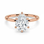 Pear cut Moissanite lab grown diamond engagement ring round shank with a six claw setting, on a gold band, against a white background.Moissanite engagement ring cape town south africa grand diamonds ralph jacobs jeuli