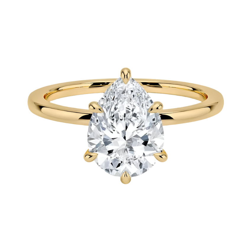 Pear cut Moissanite lab grown diamond engagement ring round shank with a six claw setting, on a gold band, against a white background.Moissanite engagement ring cape town south africa grand diamonds ralph jacobs jeuli