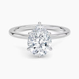 Pear cut Moissanite lab grown diamond engagement ring round shank with a six claw setting, on a gold band, against a white background.Moissanite engagement ring cape town south africa grand diamonds ralph jacobs jeuli