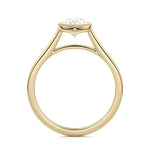 Pear shape Moissanite lab grown diamond engagement ring round shank with a bezel setting, on a gold band, against a white background.Moissanite engagement ring cape town south africa grand diamonds ralph jacobs jeulia 