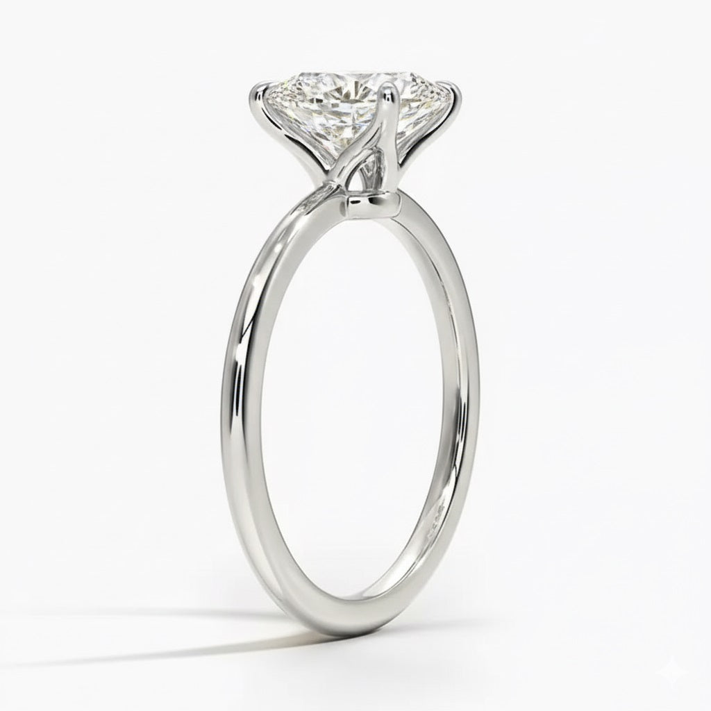 Princess cut Moissanite lab grown diamond engagement ring round shank with a four claw setting, on a gold band, against a white background.Moissanite engagement ring cape town south africa grand diamonds ralph jacobs jeuli