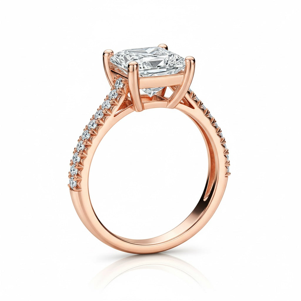 Princess cut Moissanite lab grown diamond engagement ring pave set shank with a four claw setting, on a gold band, against a white background.Moissanite engagement ring cape town south africa grand diamonds ralph jacobs jeulia 
