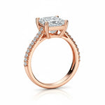 Princess cut Moissanite lab grown diamond engagement ring pave set shank with a four claw setting, on a gold band, against a white background.Moissanite engagement ring cape town south africa grand diamonds ralph jacobs jeulia 