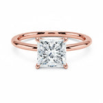 Princess cut Moissanite lab grown diamond engagement ring round shank with a four claw setting, on a gold band, against a white background.Moissanite engagement ring cape town south africa grand diamonds ralph jacobs jeulia 