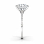 Radiant cut Moissanite lab grown diamond engagement ring pave set shank with classic four prong setting, on a gold band, against a white background.Moissanite engagement ring cape town south africa grand diamonds ralph jacobs jeulia 