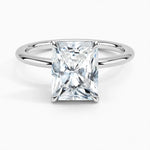 Radiant cut Moissanite lab grown diamond engagement ring round shank with a four claw setting, on a gold band, against a white background.Moissanite engagement ring cape town south africa grand diamonds ralph jacobs jeuli