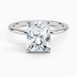 Radiant cut Moissanite lab grown diamond engagement ring round shank with a four claw setting, on a gold band, against a white background.Moissanite engagement ring cape town south africa grand diamonds ralph jacobs jeuli