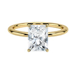 Radiant cut Moissanite lab grown diamond engagement ring round shank with a four claw setting, on a gold band, against a white background.Moissanite engagement ring cape town south africa grand diamonds ralph jacobs jeuli