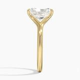 Engagement ring Radiant cut Moissanite lab grown diamond engagement ring v-Split round shank with a four cat-claw setting, on a gold band, against a white background.Moissanite engagement ring cape town south africa grand diamonds ralph jacobs jeulia 