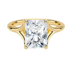 Engagement ring Radiant cut Moissanite lab grown diamond engagement ring v-Split round shank with a four cat-claw setting, on a gold band, against a white background.Moissanite engagement ring cape town south africa grand diamonds ralph jacobs jeulia 