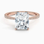 Radiant cut Moissanite lab grown diamond engagement ring pave set shank with classic four prong setting, on a gold band, against a white background.Moissanite engagement ring cape town south africa grand diamonds ralph jacobs jeulia 