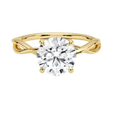 Round cut Moissanite lab grown diamond engagement ring twisted  band with a four claw setting, on a gold band, against a white background.Moissanite engagement ring cape town south africa grand diamonds ralph jacobs jeulia  
