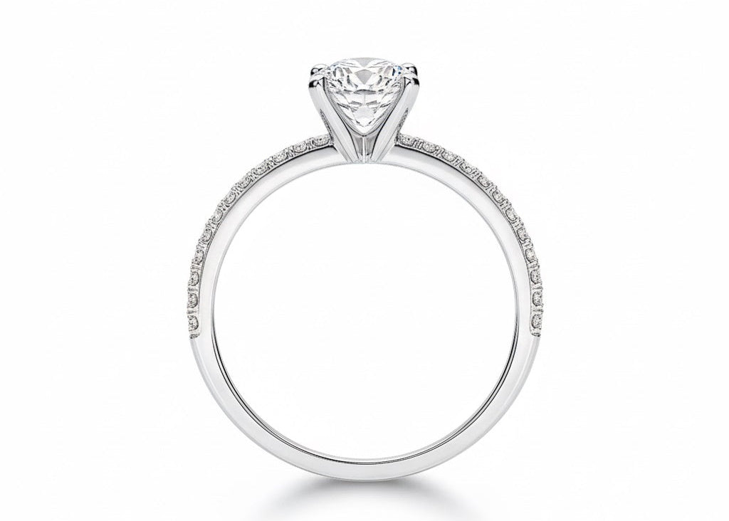 Round cut Moissanite lab grown diamond engagement ring with split pave set gold shank, against a white background.Moissanite engagement ring cape town south africa grand diamonds ralph jacobs jeulia 