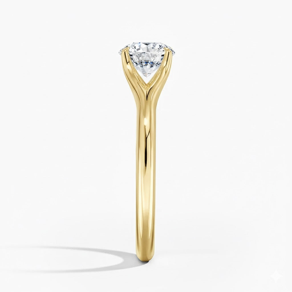 Round cut Split Shank Moissanite lab grown diamond engagement ring round shank with a six claw setting, on a gold band, against a white background.Moissanite engagement ring cape town south africa grand diamonds ralph jacobs jeuli