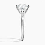 Round cut Moissanite lab grown diamond engagement ring round shank with a six claw setting, on a gold band, against a white background.Moissanite engagement ring cape town south africa grand diamonds ralph jacobs jeuli