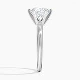 Round cut Moissanite lab grown diamond engagement ring round shank with a six claw setting, on a gold band, against a white background.Moissanite engagement ring cape town south africa grand diamonds ralph jacobs jeuli