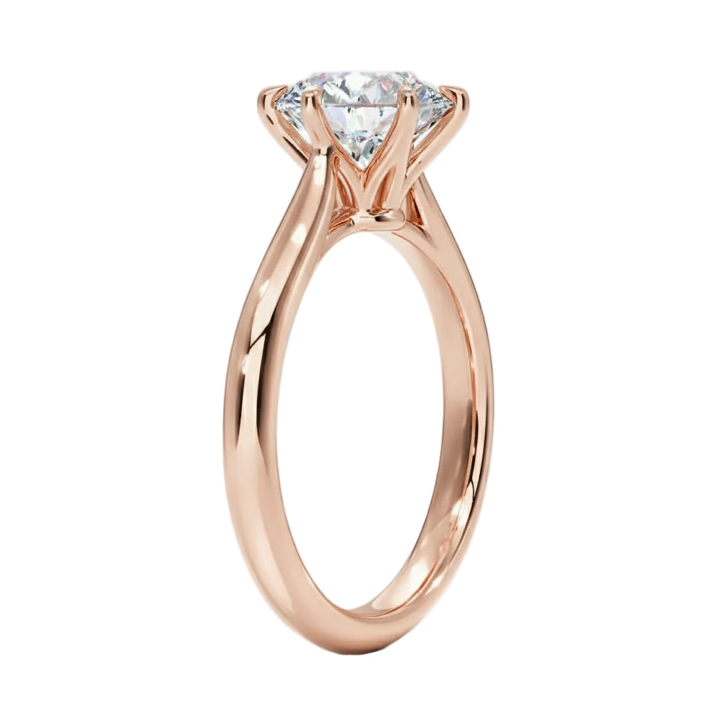 Round cut Moissanite lab grown diamond engagement ring round band with a six claw setting, on a gold band, against a white background.Moissanite engagement ring cape town south africa grand diamonds ralph jacobs jeulia  