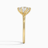 Round cut Moissanite lab grown diamond engagement ring round shank with a six claw setting, on a gold band, against a white background.Moissanite engagement ring cape town south africa grand diamonds ralph jacobs jeulia 