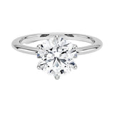 Round cut Moissanite lab grown diamond engagement ring round band with a six claw setting, on a gold band, against a white background.Moissanite engagement ring cape town south africa grand diamonds ralph jacobs jeulia  