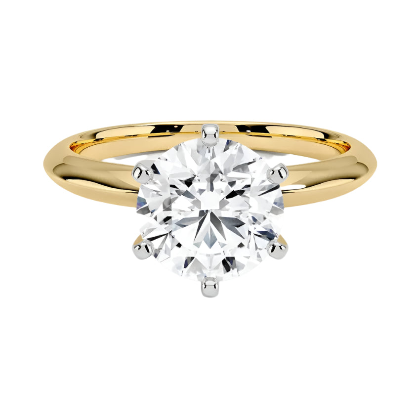 Round cut Moissanite lab grown diamond engagement ring round shank with a six claw setting, on a gold band, against a white background.Moissanite engagement ring cape town south africa grand diamonds ralph jacobs jeuli