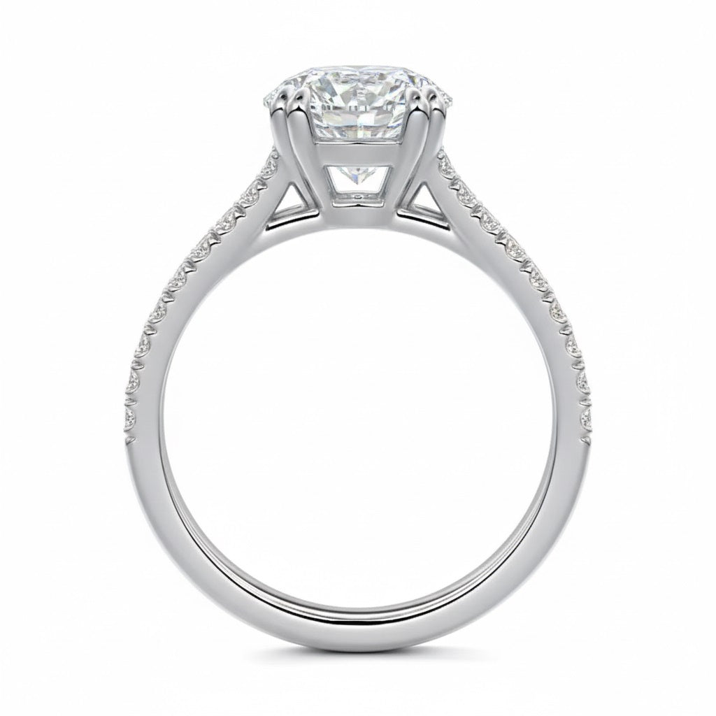 Round cut Cathedral Double claw set Moissanite lab grown diamond engagement ring with pave set V_split shank on a gold band, against a white background.Moissanite engagement ring cape town south africa grand diamonds ralph jacobs jeulia 