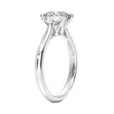 Round cut Moissanite lab grown diamond engagement ring round band with a six claw setting, on a gold band, against a white background.Moissanite engagement ring cape town south africa grand diamonds ralph jacobs jeulia  