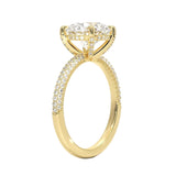 Round cut Moissanite lab grown diamond engagement ring with three row micro pave set gold shank, hidden halo and encrusted claws against a white background.Moissanite engagement ring cape town south africa grand diamonds ralph jacobs jeulia 