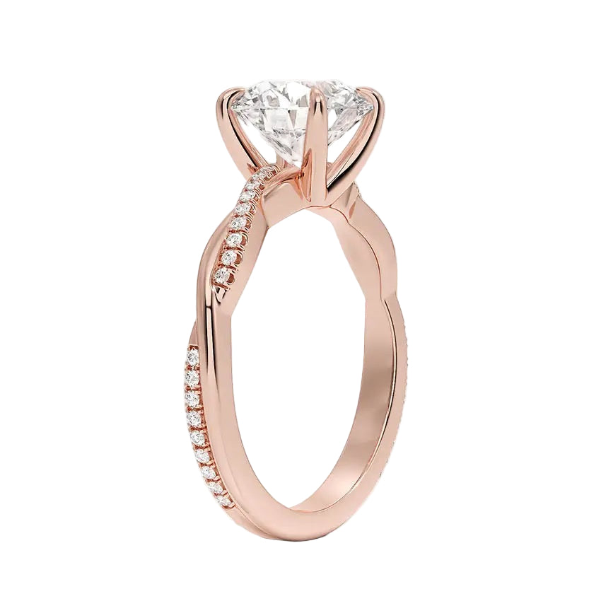 Round cut Moissanite lab grown diamond engagement ring with single side pave set twisted shank on a gold band, against a white background.Moissanite engagement ring cape town south africa grand diamonds ralph jacobs jeulia 