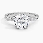 Round cut Moissanite lab grown diamond engagement ring with single side pave set twisted shank on a gold band, against a white background.Moissanite engagement ring cape town south africa grand diamonds ralph jacobs jeulia 