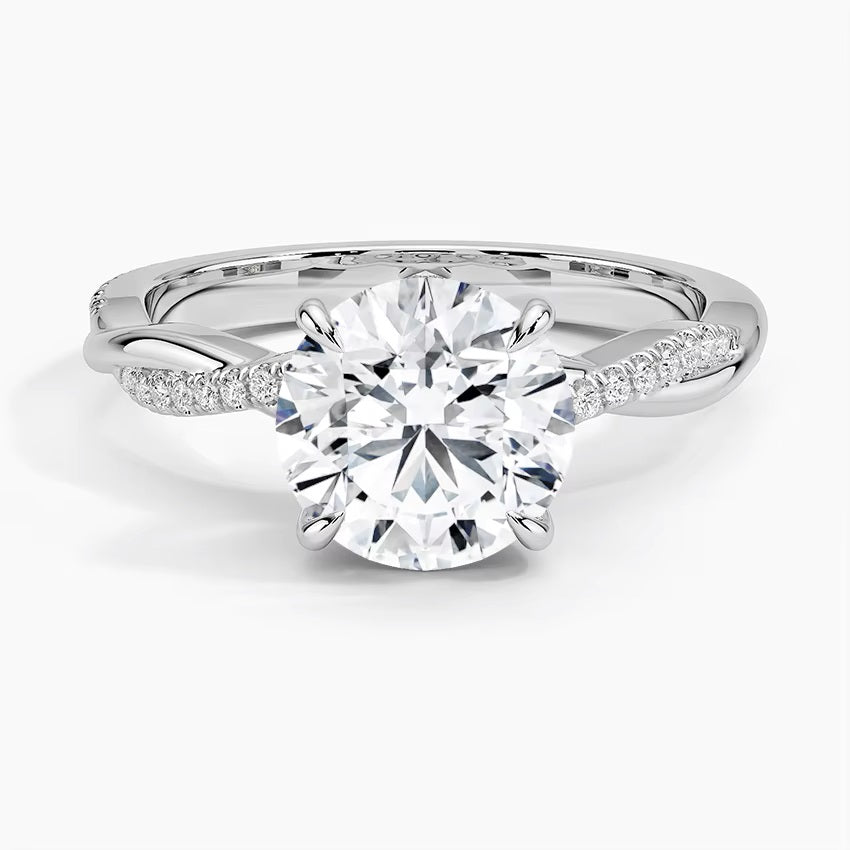 Round cut Moissanite lab grown diamond engagement ring with single side pave set twisted shank on a gold band, against a white background.Moissanite engagement ring cape town south africa grand diamonds ralph jacobs jeulia 